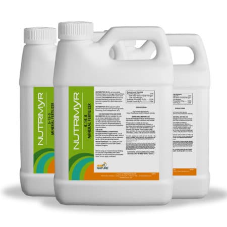 Foliar spray of Nutrimyr 5-15-5 being applied to crops to support nutrient uptake and reduce plant stress during critical growth stages.