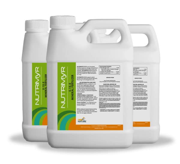 Foliar spray of Nutrimyr 5-15-5 being applied to crops to support nutrient uptake and reduce plant stress during critical growth stages.